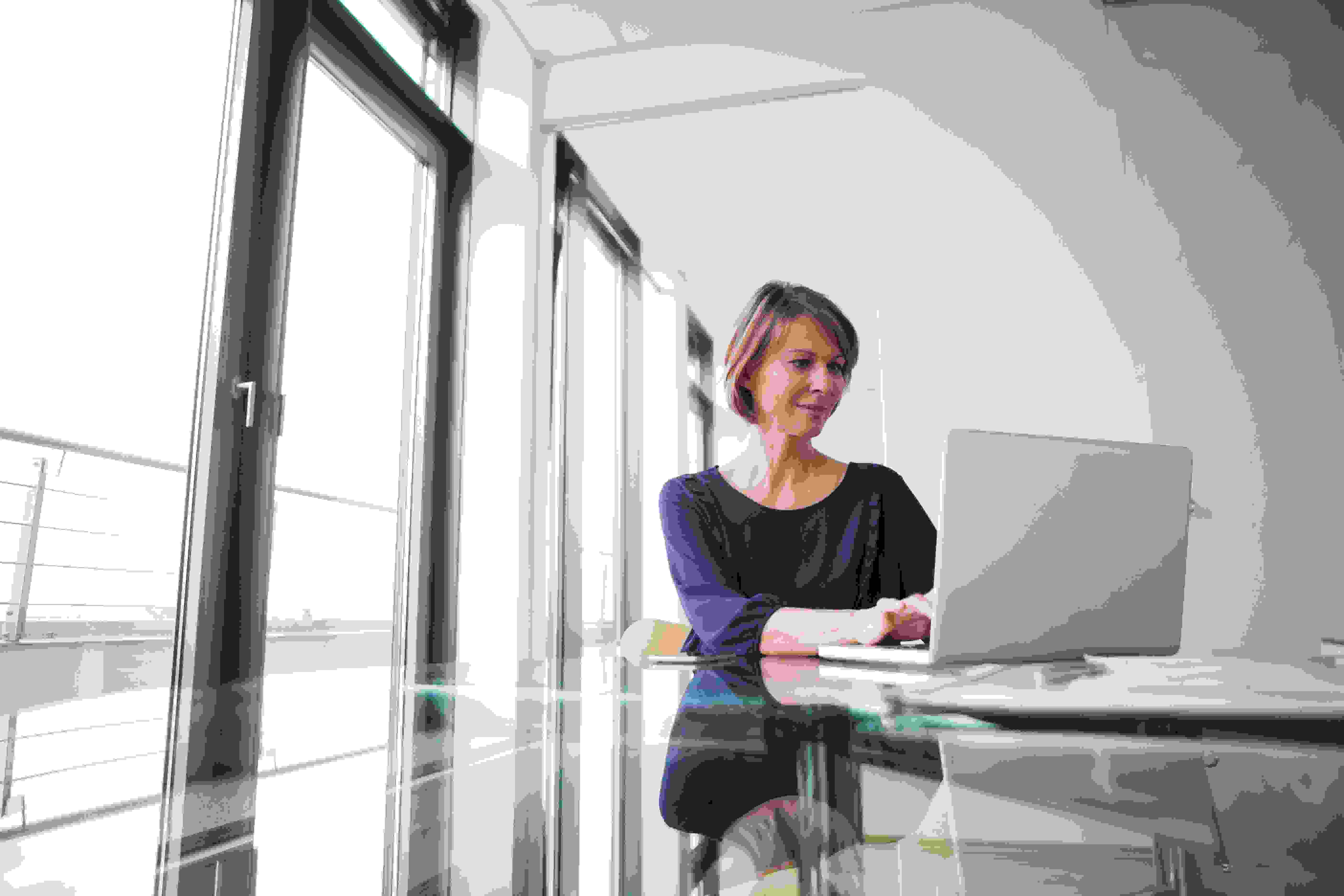 Businesswoman Working On Laptop At Office Desk 2022 03 08 01 29 29 Utc